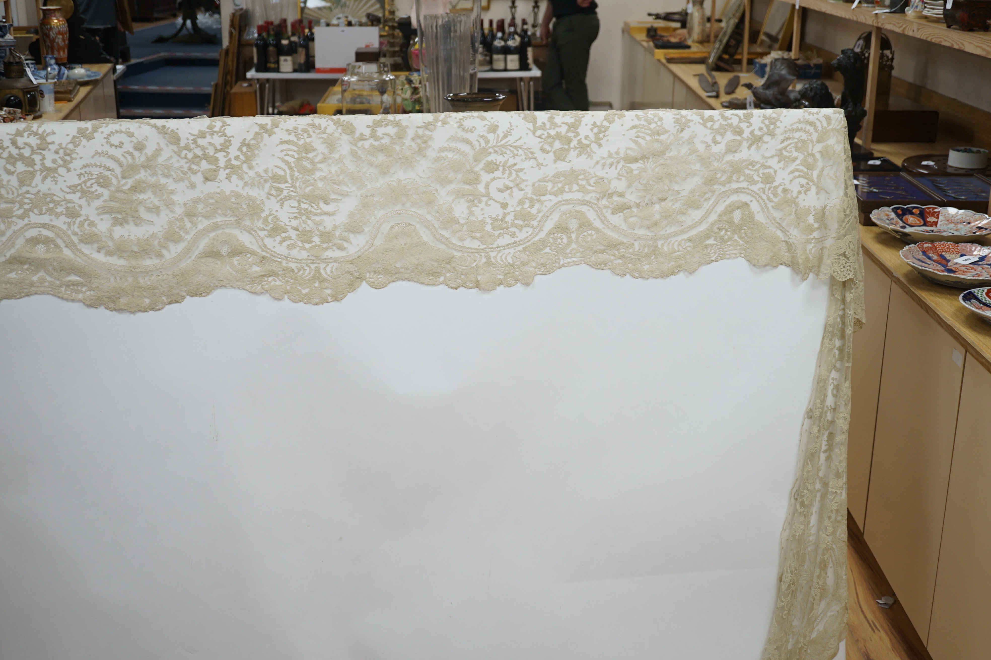 A rare length (9 and a half yards) of Brussels 19th century needle lace, some repairs and damage, circa 1880 and a similar wedding veil